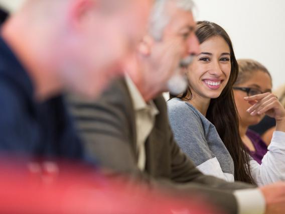 student smiling in class, University of Arizona, Tucson