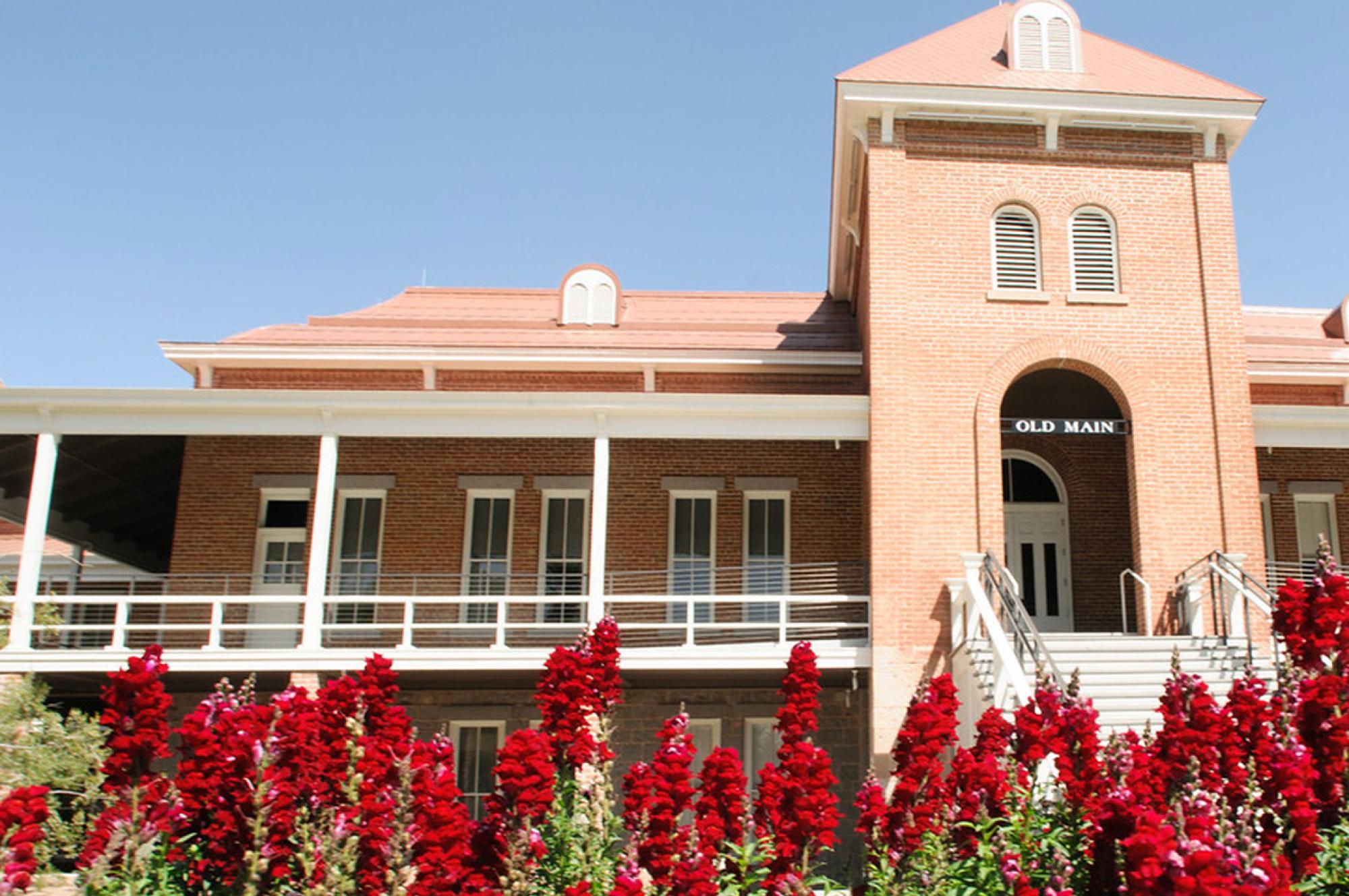 view of Old Main with blooming flowers, University of Arizona